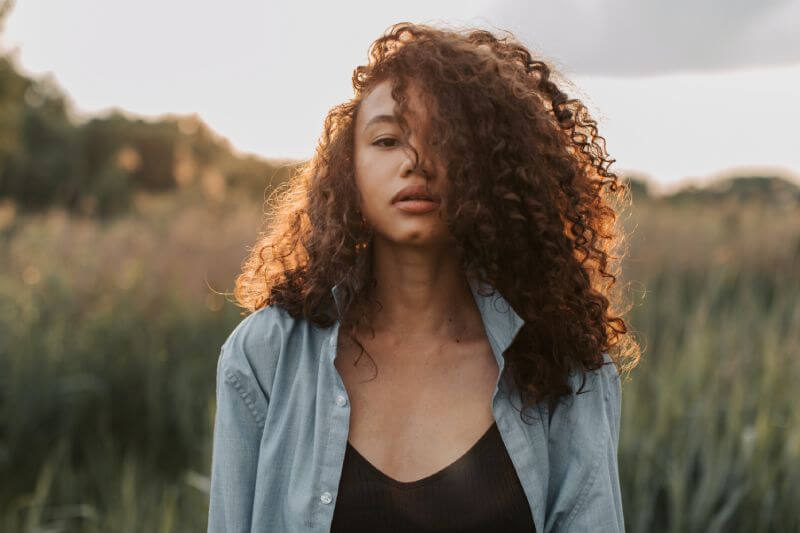curly hairstyle with moringa oil