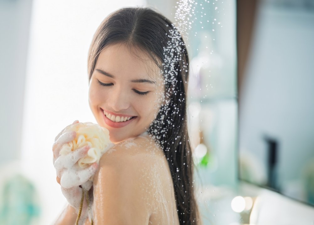 Woman scrubbing in the shower