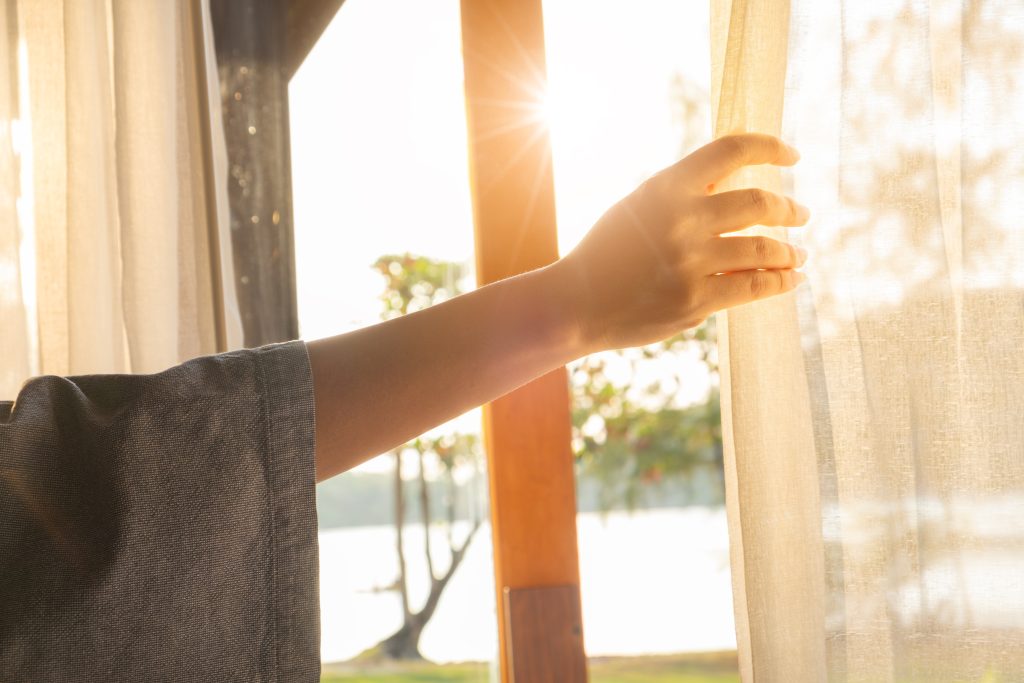 a woman gazing outside the window