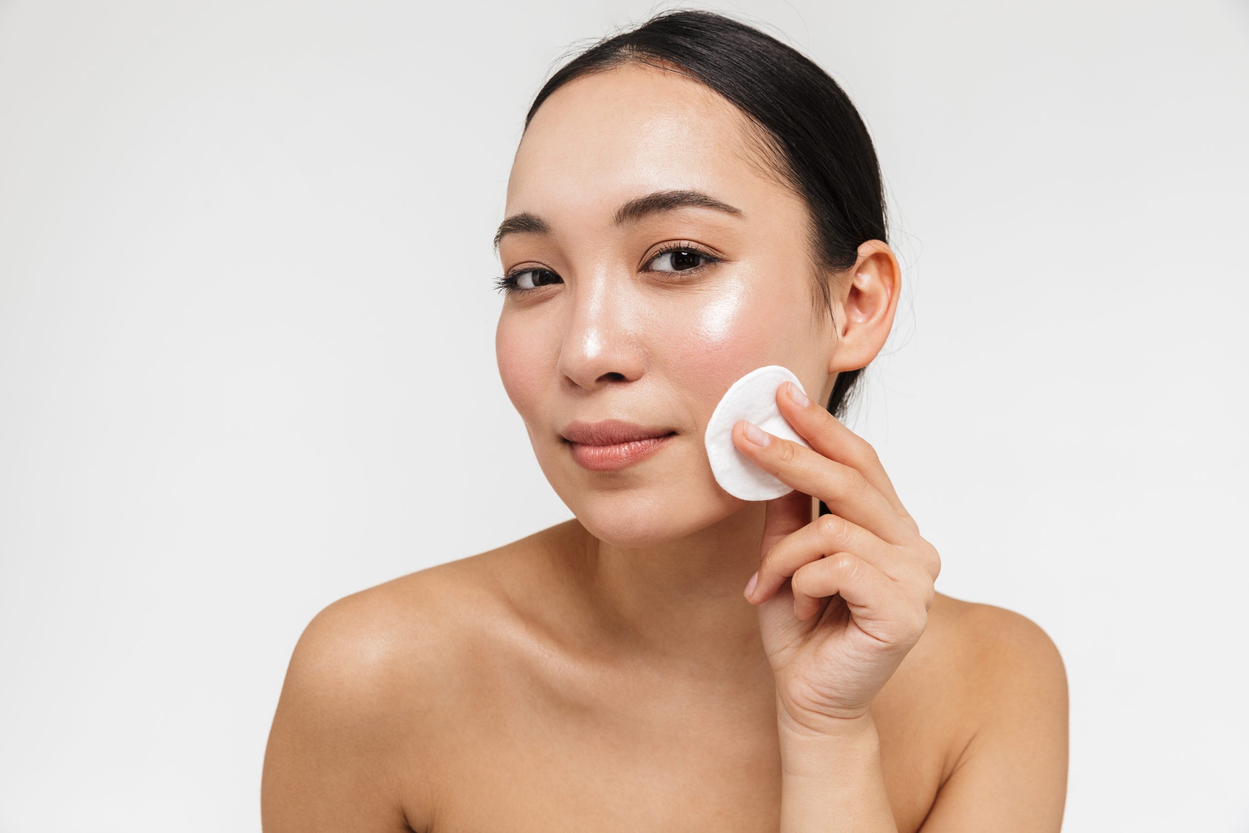 a woman putting in toner