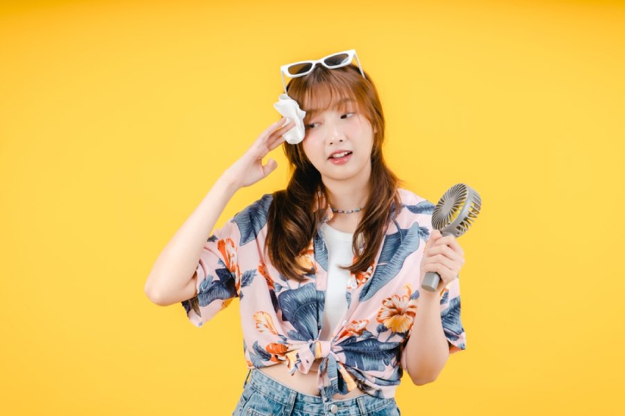 asian woman sweating during summer
