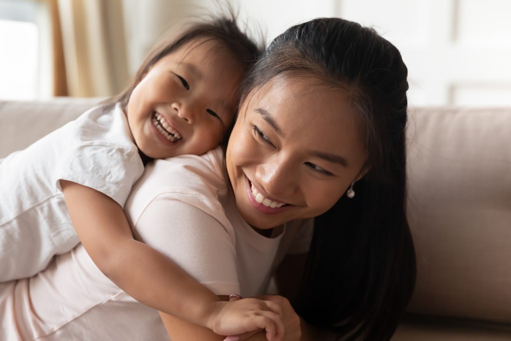 mother and her daughter smiling
