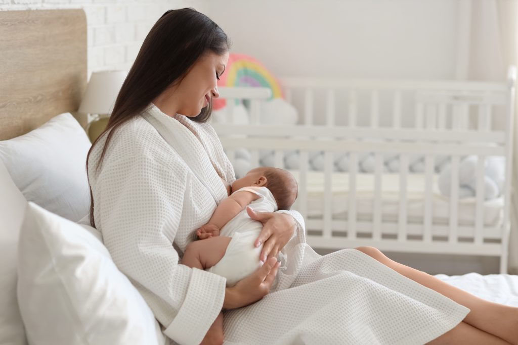 a mom breastfeeding her baby