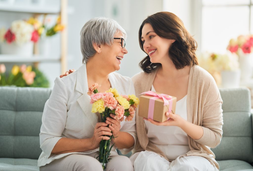 mother and daughter smiling