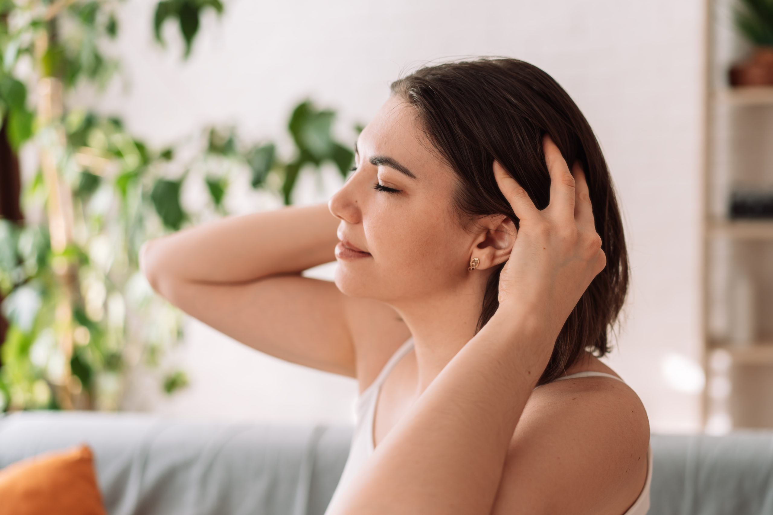 a woman massaging her hair