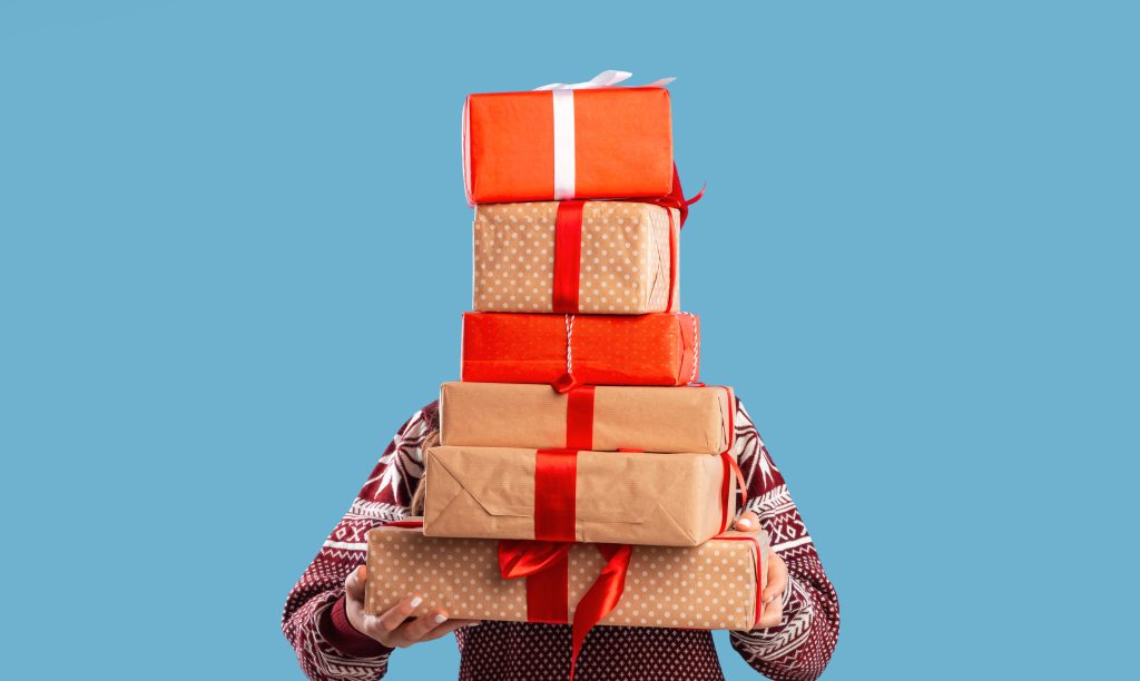 a man holding gifts